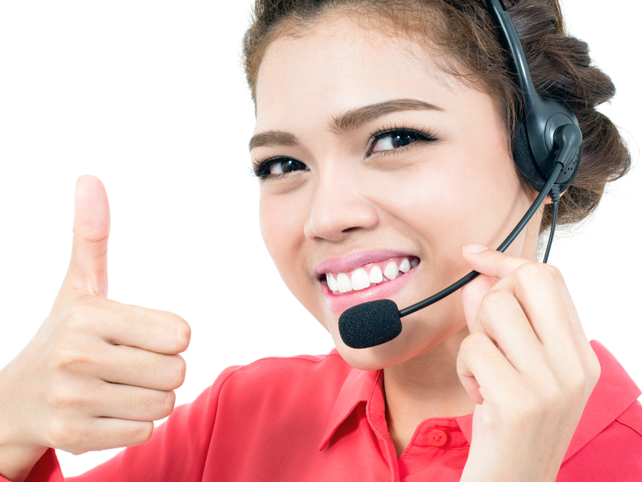 customer support agent in call center giving thumbs up in approval