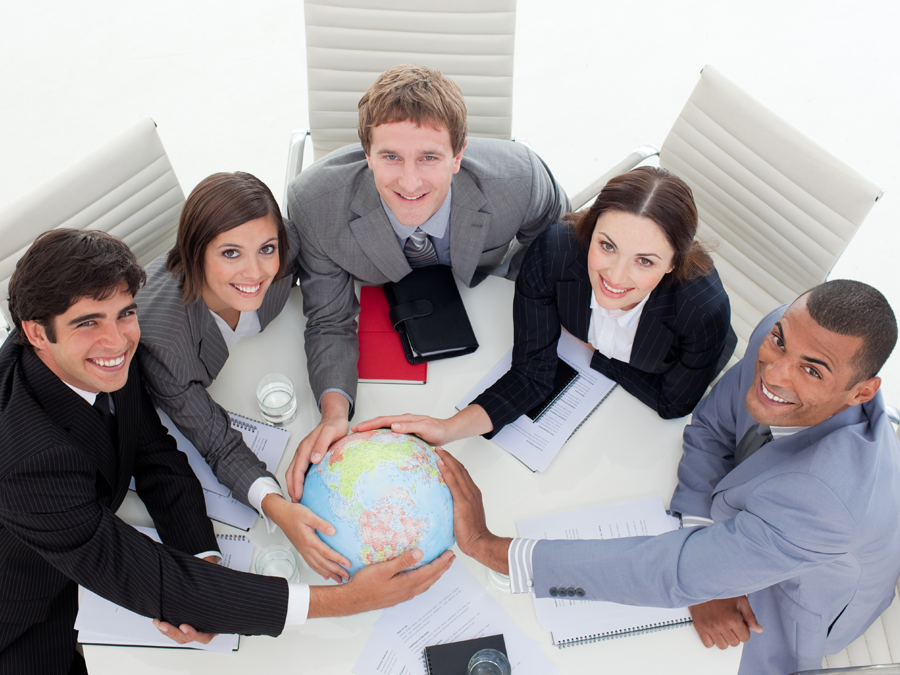 diverse business team holding globe