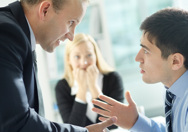 office coworkers arguing worried woman in back