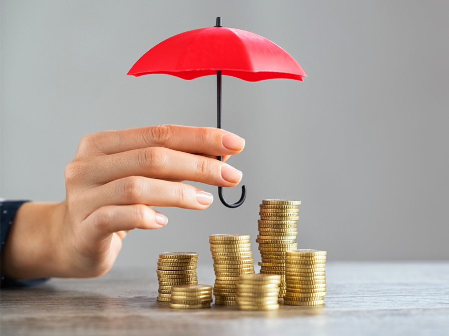 startup company facing financial risk business depiction executive hand holding umbrella over stacks of coins
