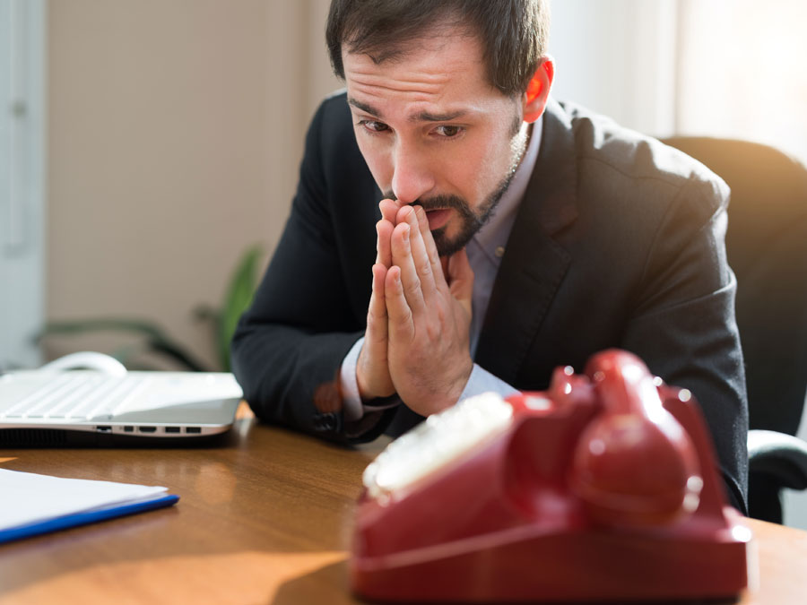 businessman waiting for call begging phone