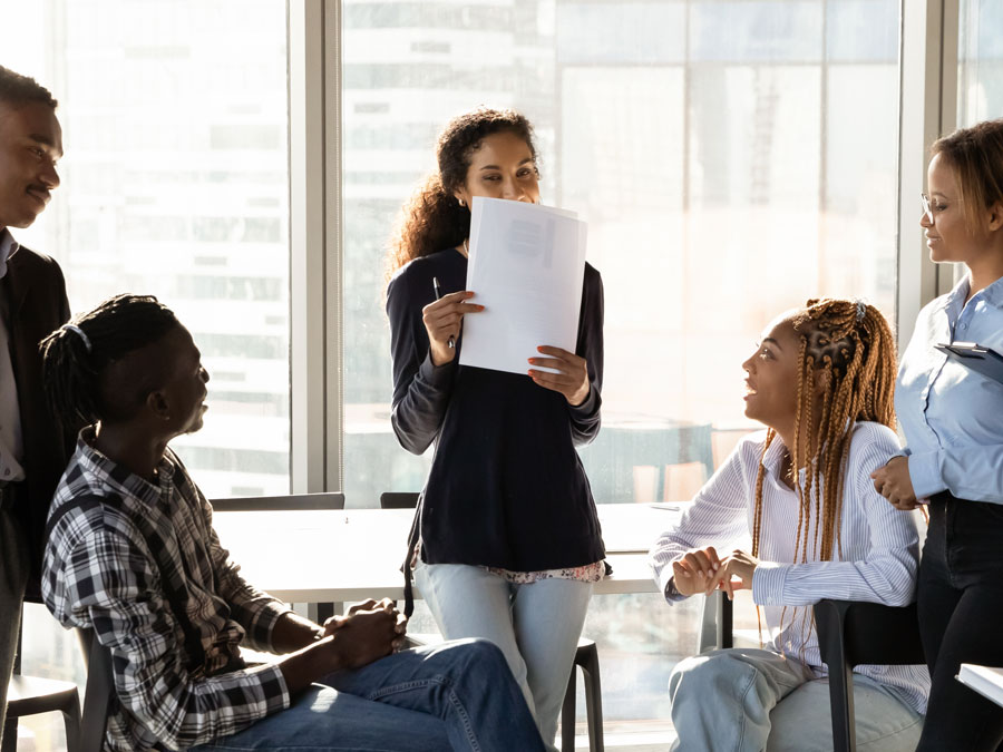 call center leadership shy boss during meeting with customer support agents in contact center