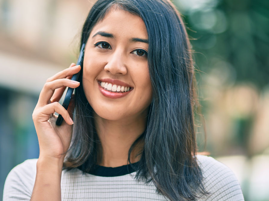 female customer speaking with call center agent over customer support channel phone