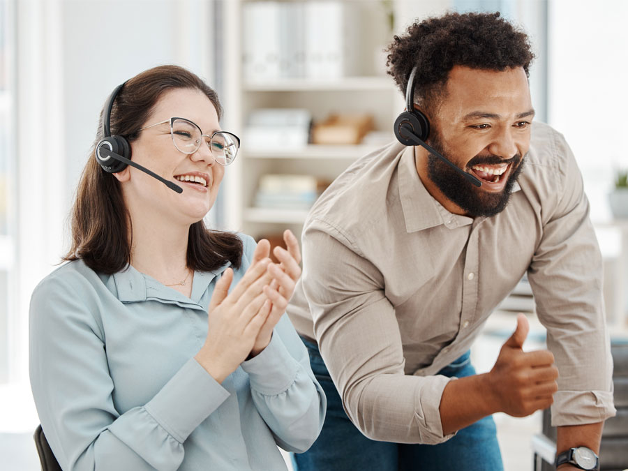 outsourced call center leadership happy employees applauding in customer service contact center