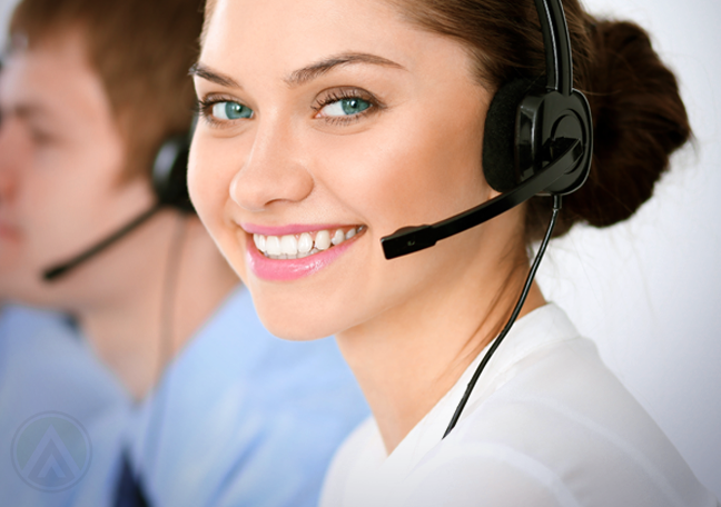 smiling customer service agent in a call center