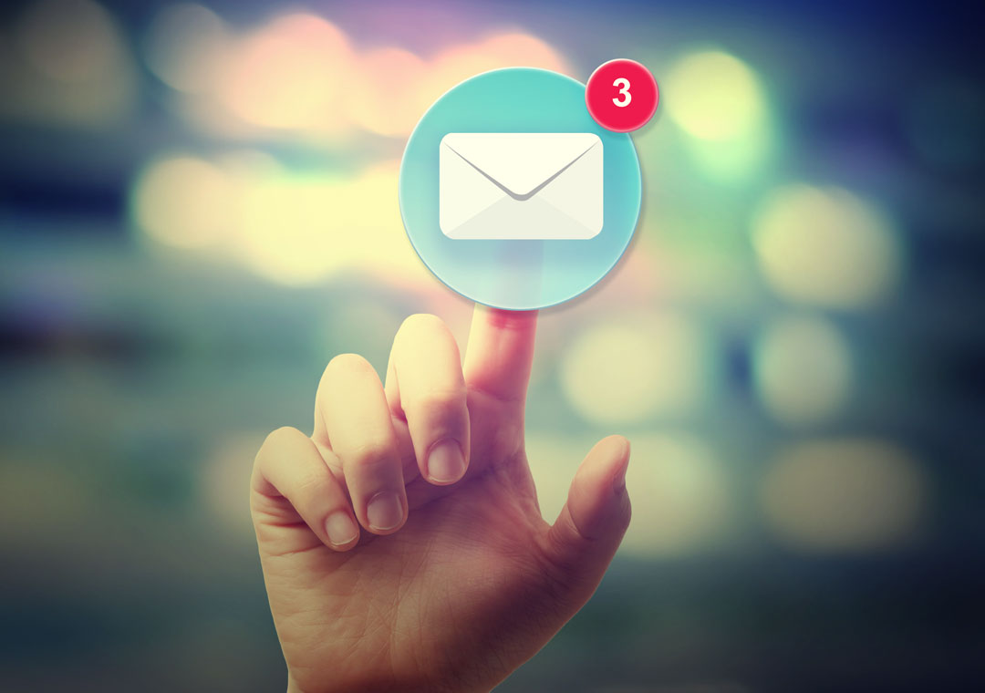 customer support agent hand tapping on email support envelope icon