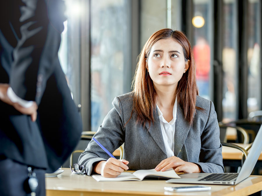 customer support agent looking worried at call center team leader