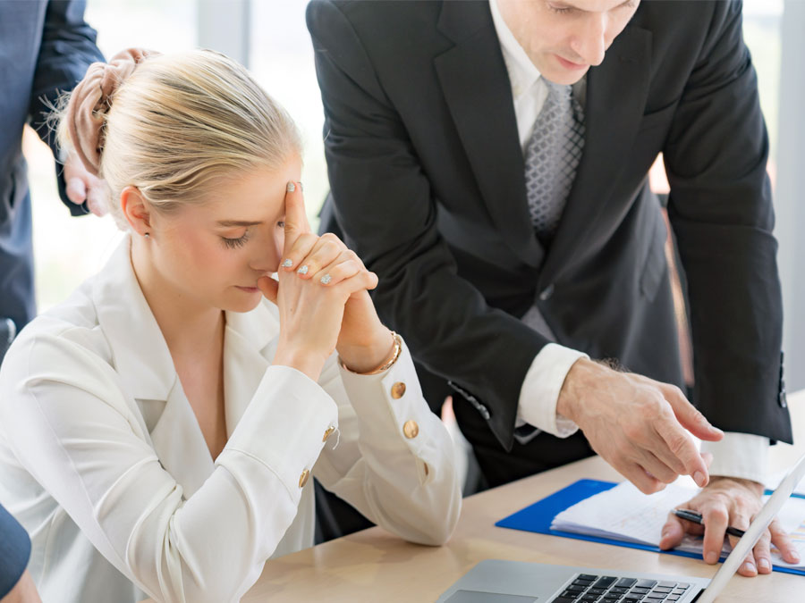 frustrated business executive with company team reviewing figures