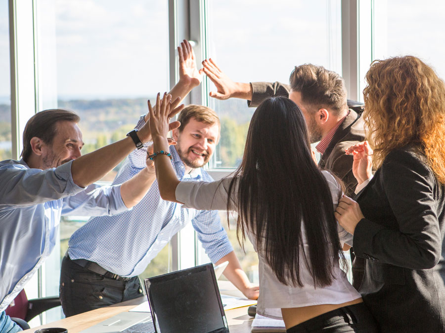 gamification depiction coworkers team high five