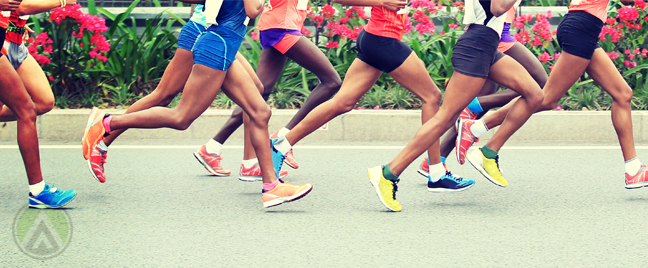 athletes legs running in marathon