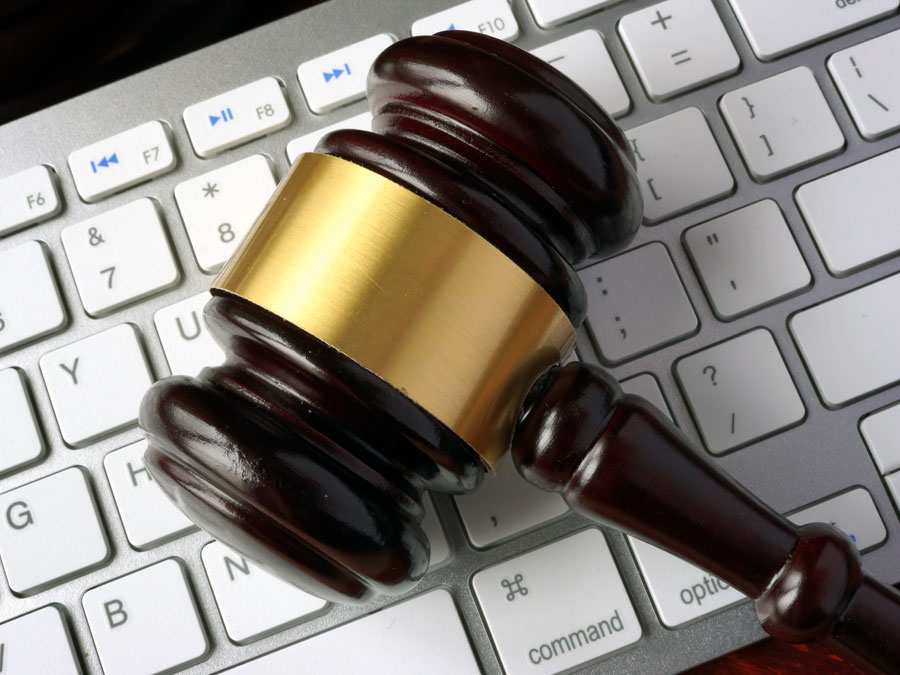 data security GDPR depiction judge gavel on computer keyboard