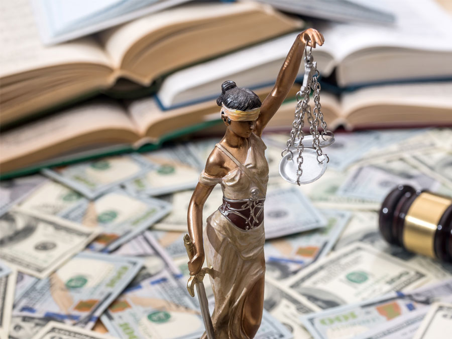 lady justice judge gavel surrounded by money cash for data security