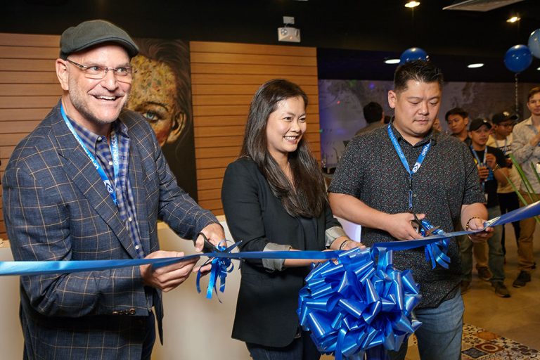 Open Access BPO executives cut ribbon to launch new office