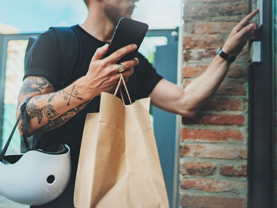 on demand gig economy worker ringing doorbell making delivery to customer