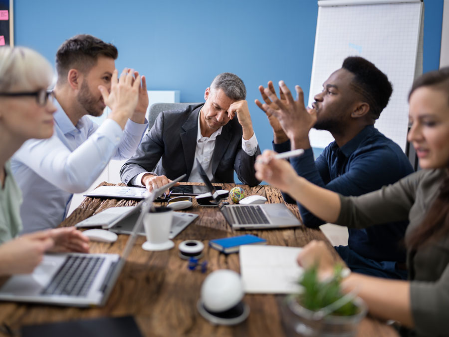 diverse workplace team in meeting argument