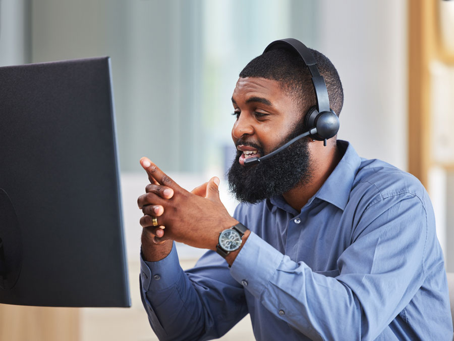 technical support agent assisting customer over the phone giving instructions