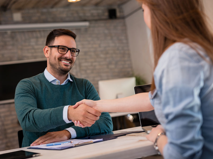 technical support agents shaking hands with hiring hr recruitment