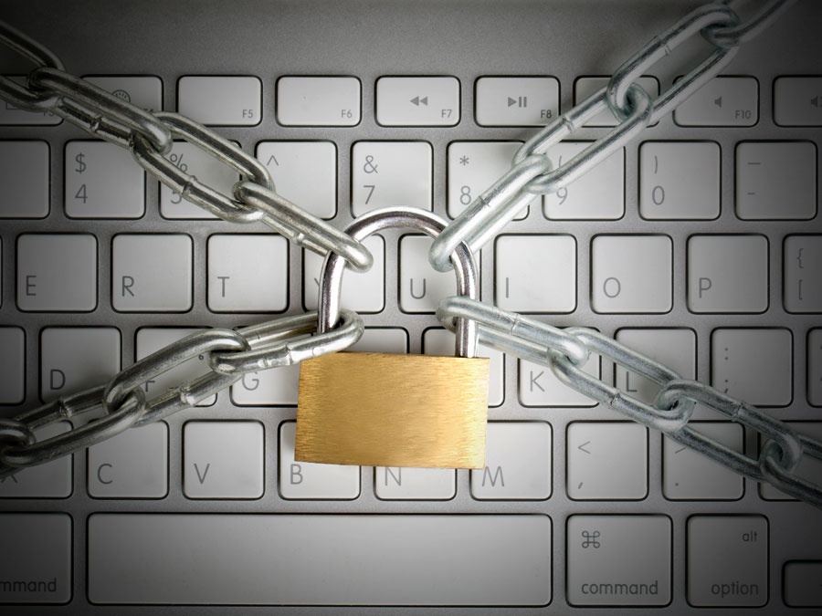 outsourcing to a call center ecommerce fraud depiction padlock chain around computer keyboard