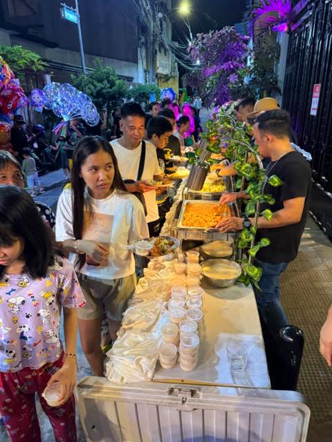 People lining up for food during the Easter Community Initiative | Open Access BPO