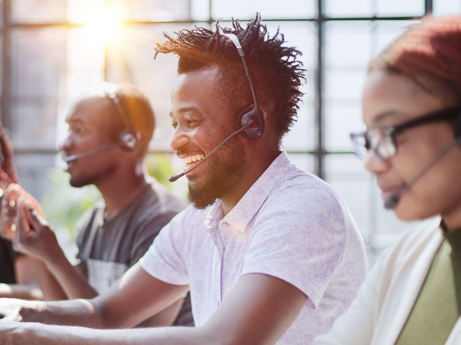 Open Access BPO smiling diverse customer support team working in outsourcing CX call center 