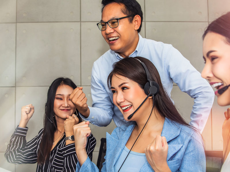 expert customer experience strategy call center team happy celebrating success