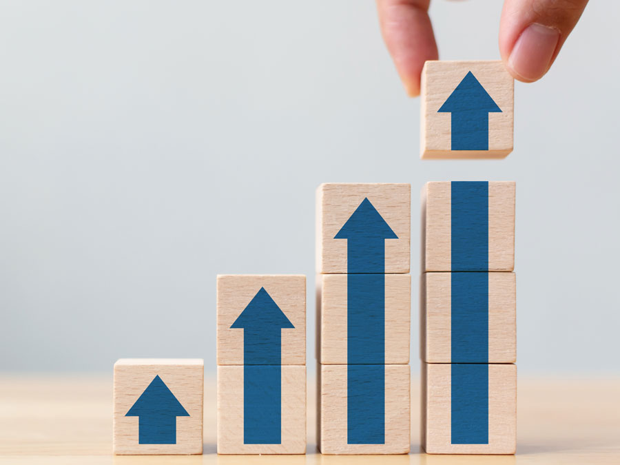 24 7 call center outsourcing benefit business growth wood blocks arrows up