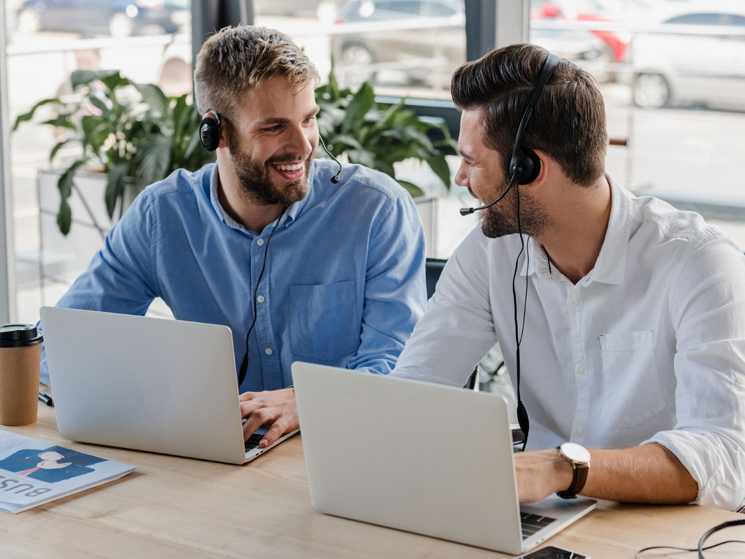 Call Center Agent Experience depiction customer support reps smiling at each other