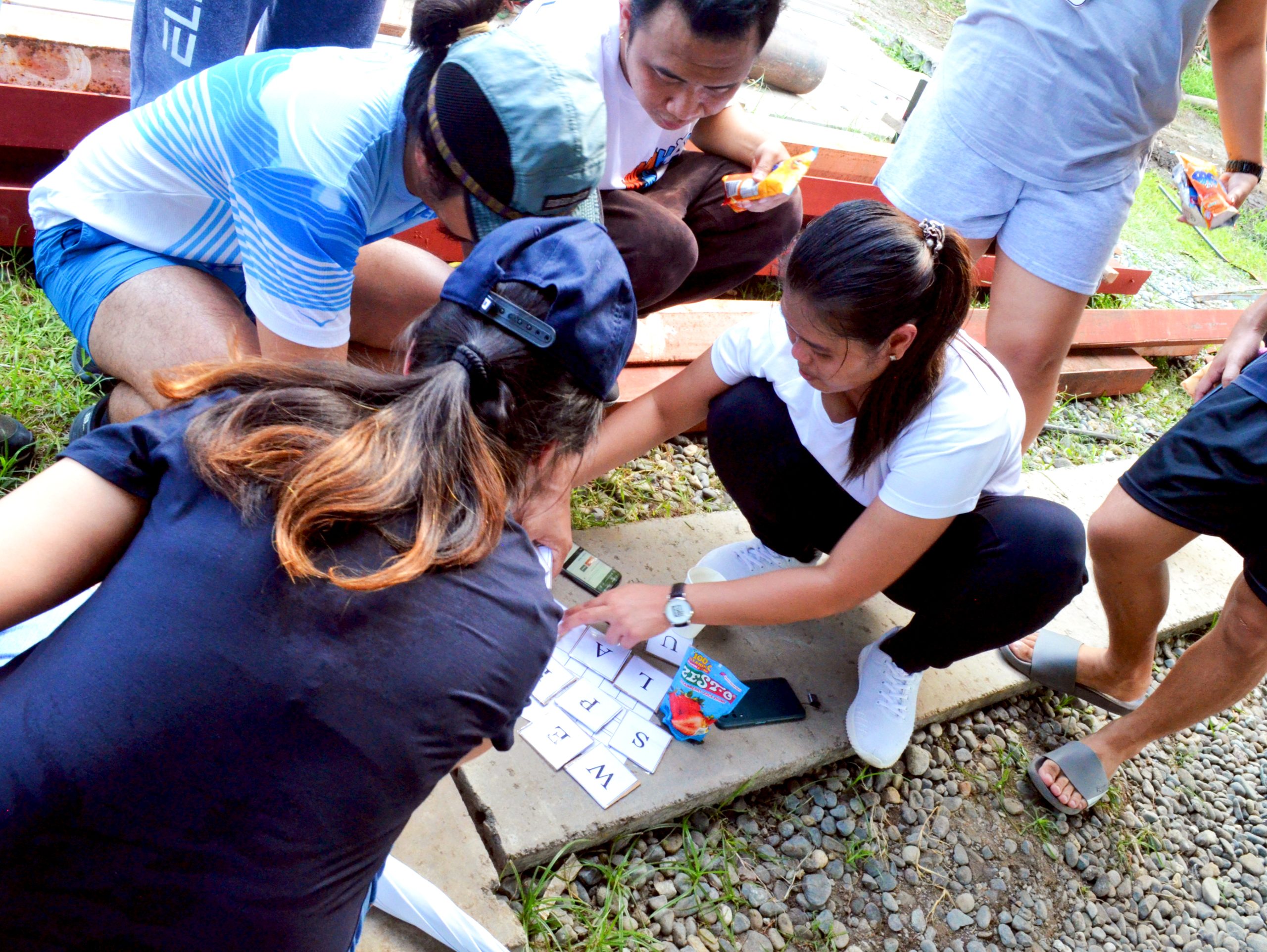 Open Access BPO Davao employees on puzzle challenges during anniversary