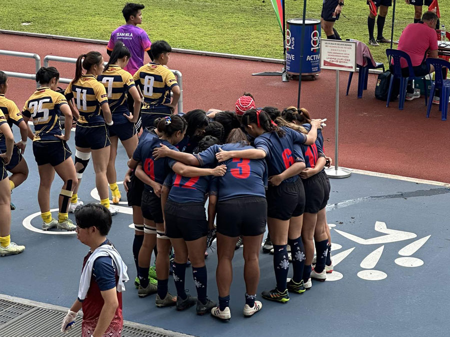 Open Access BPO Rugby team Rising Stars in team huddle before match