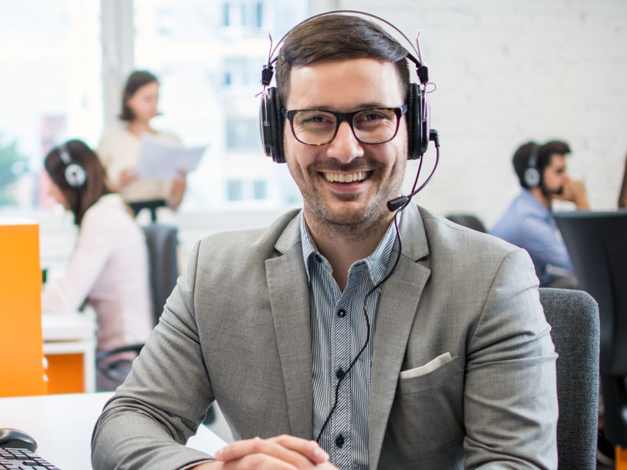 business strategy OABPO call center customer support agent smiling listening to customer feedback