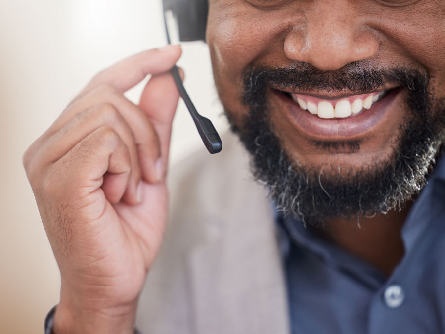 call center recruitment strategies agent smiling closeup assisting consumer on phone