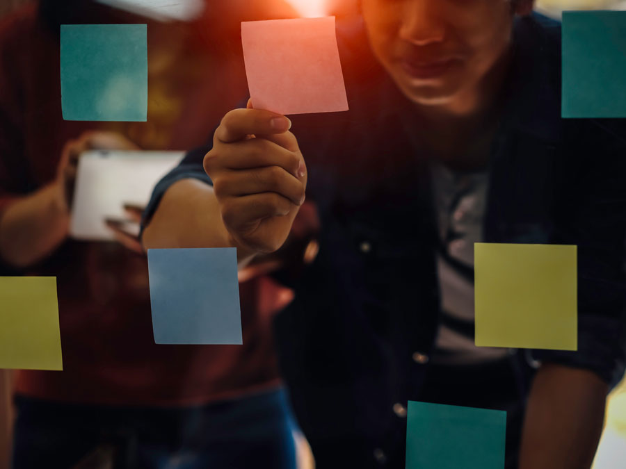 call center team making decisions on post it notes