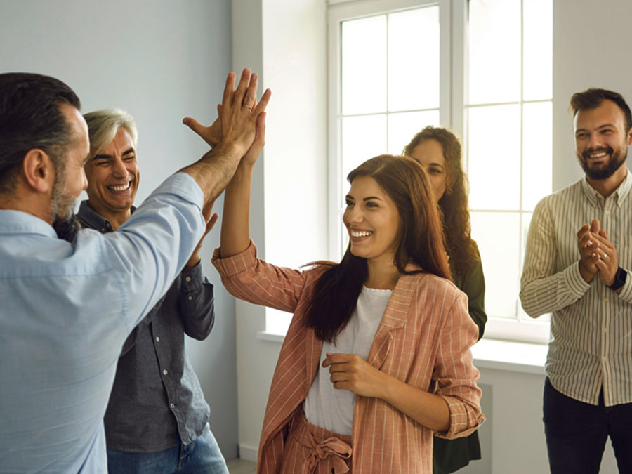 celebrating outsourcing call center agents giving high five