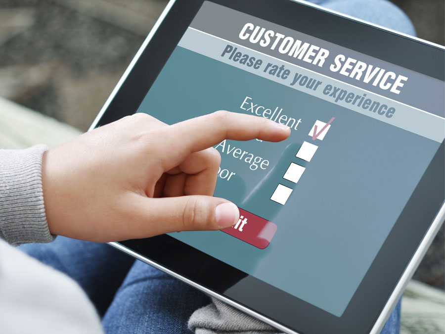 consumer taking customer support survey on tablet