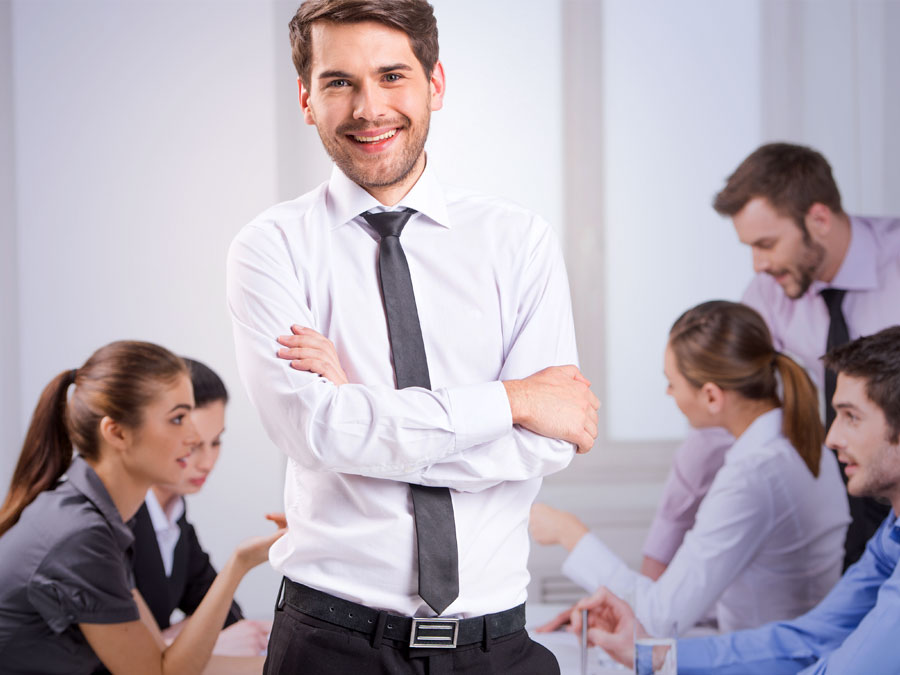 contact center leader crossed arms in the middle of customer experience team