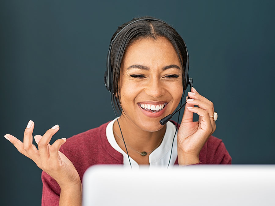 contact center reps laughing with customer over the phone