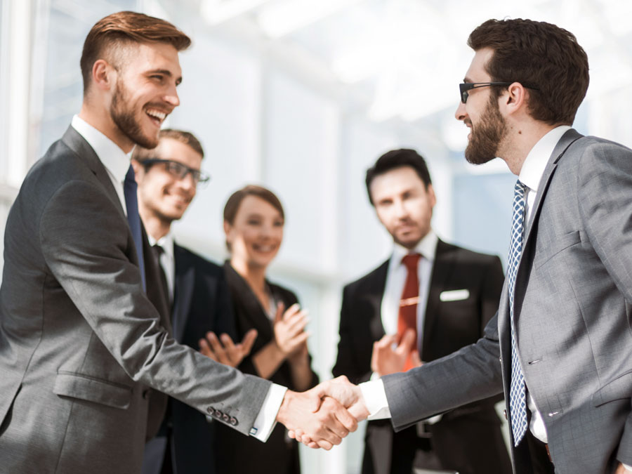 content moderator outsourcing provider shaking hands with client