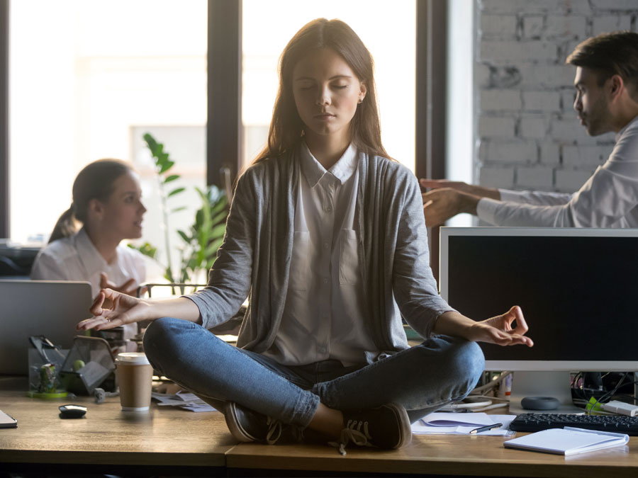 content moderator practicing self care doing yoga in office