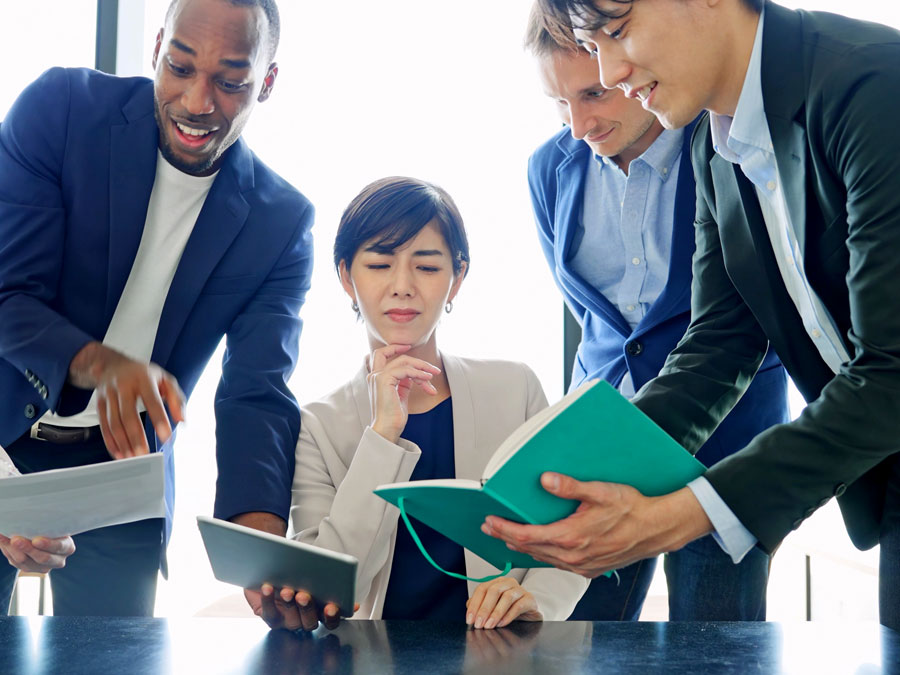 cultural awareness trainer looking at notes during call center training