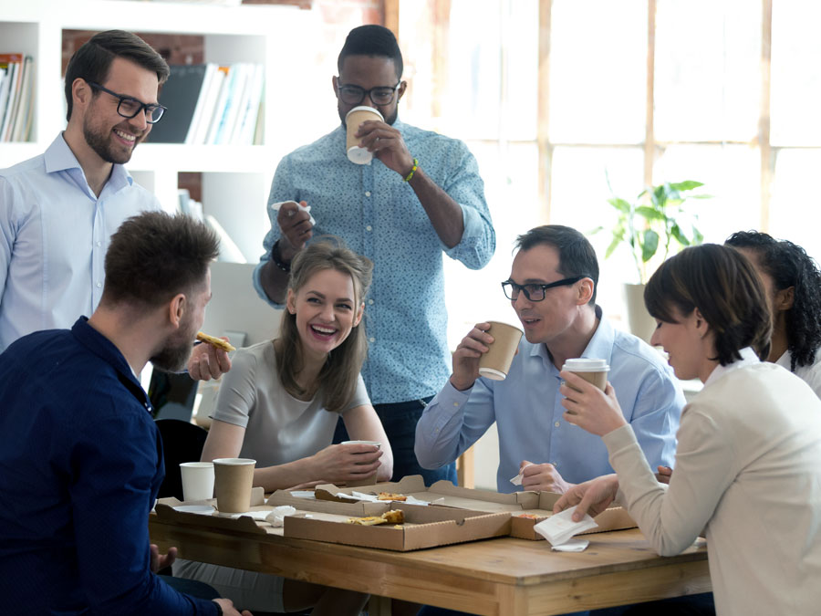customer churn management best practice employee engagement office team having fun coffee break