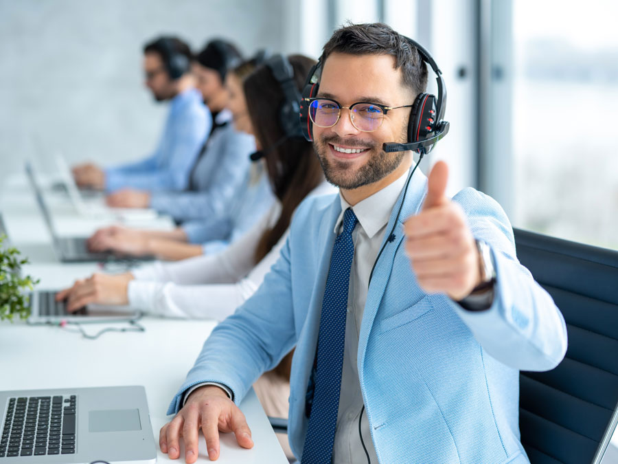 customer experience agent giving a thumbs up in call center 