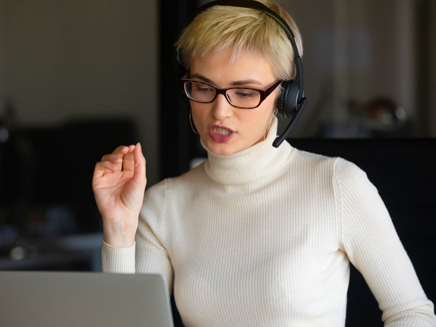 customer experience rep breaking bad news to customer over phone in call center