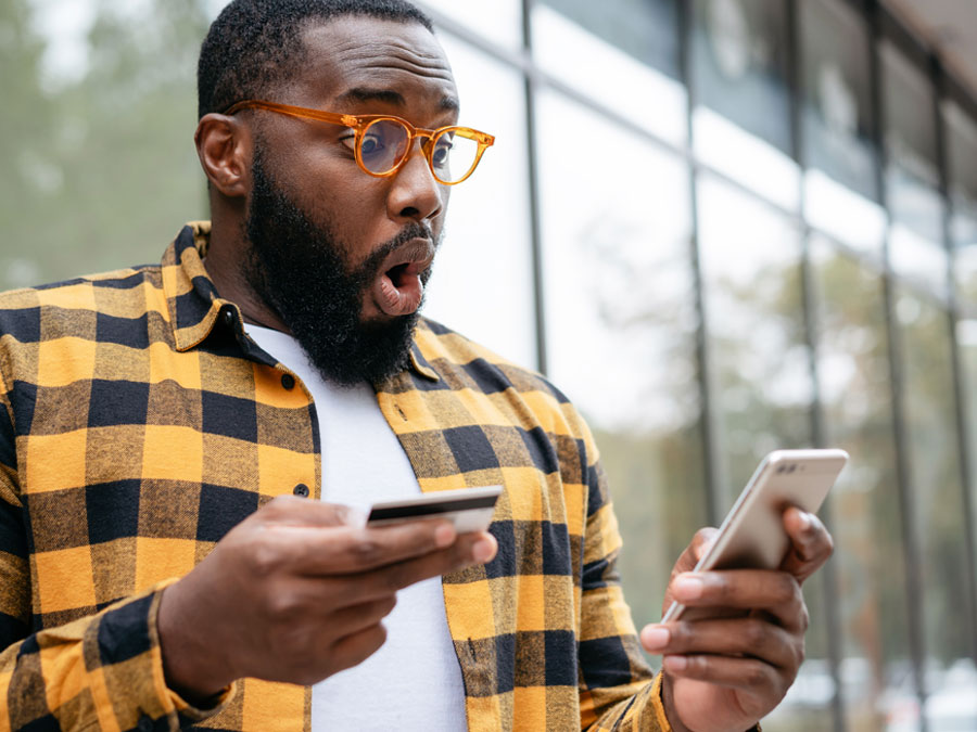 customer retention depiction man shopper excited at phone