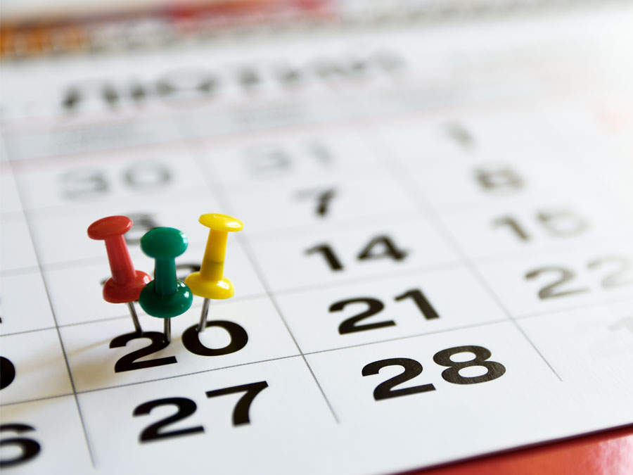customer satisfaction surveys schedule depiction pushpins on calendar 