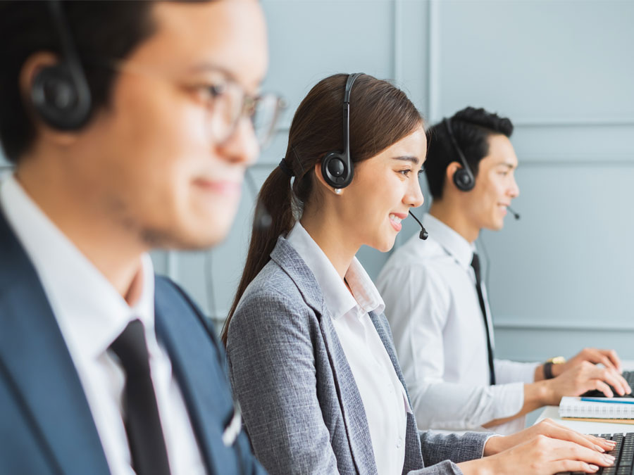 customer satisfaction team in call center busy assisting customers 