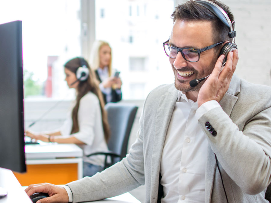 customer service agent working in call center assisting consumer over the phone