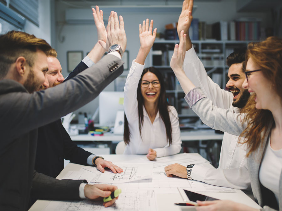 customer success team high five during call center meeting