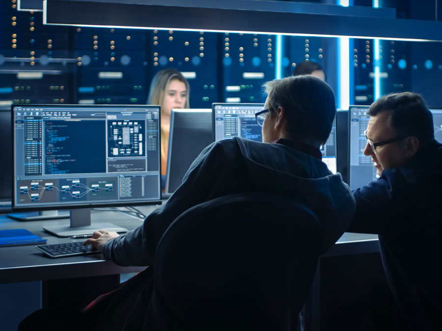 data security experts watching over computer monitors