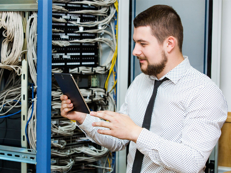 data security test IT personnel conducting call center security in server room