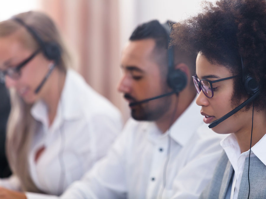 diverse call center customer experience team working in call center